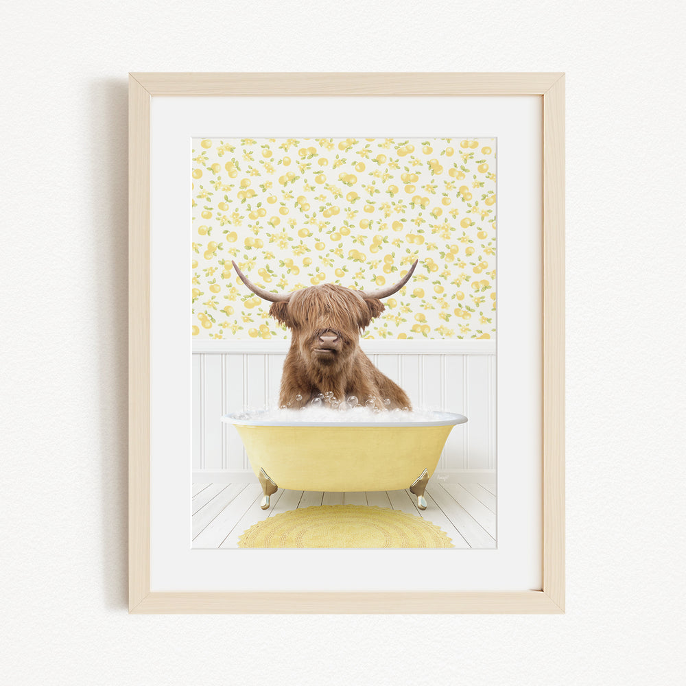 A brown cow with long horns is sitting in a yellow bathtub, surrounded by a yellow floral pattern on the wall behind it.