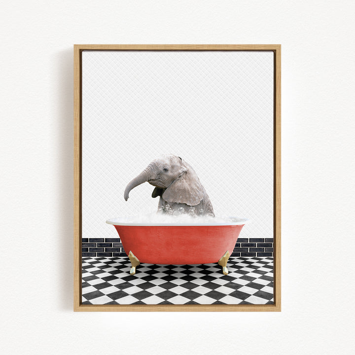 A baby elephant sitting in a red bathtub filled with water, surrounded by a black and white checkered floor.