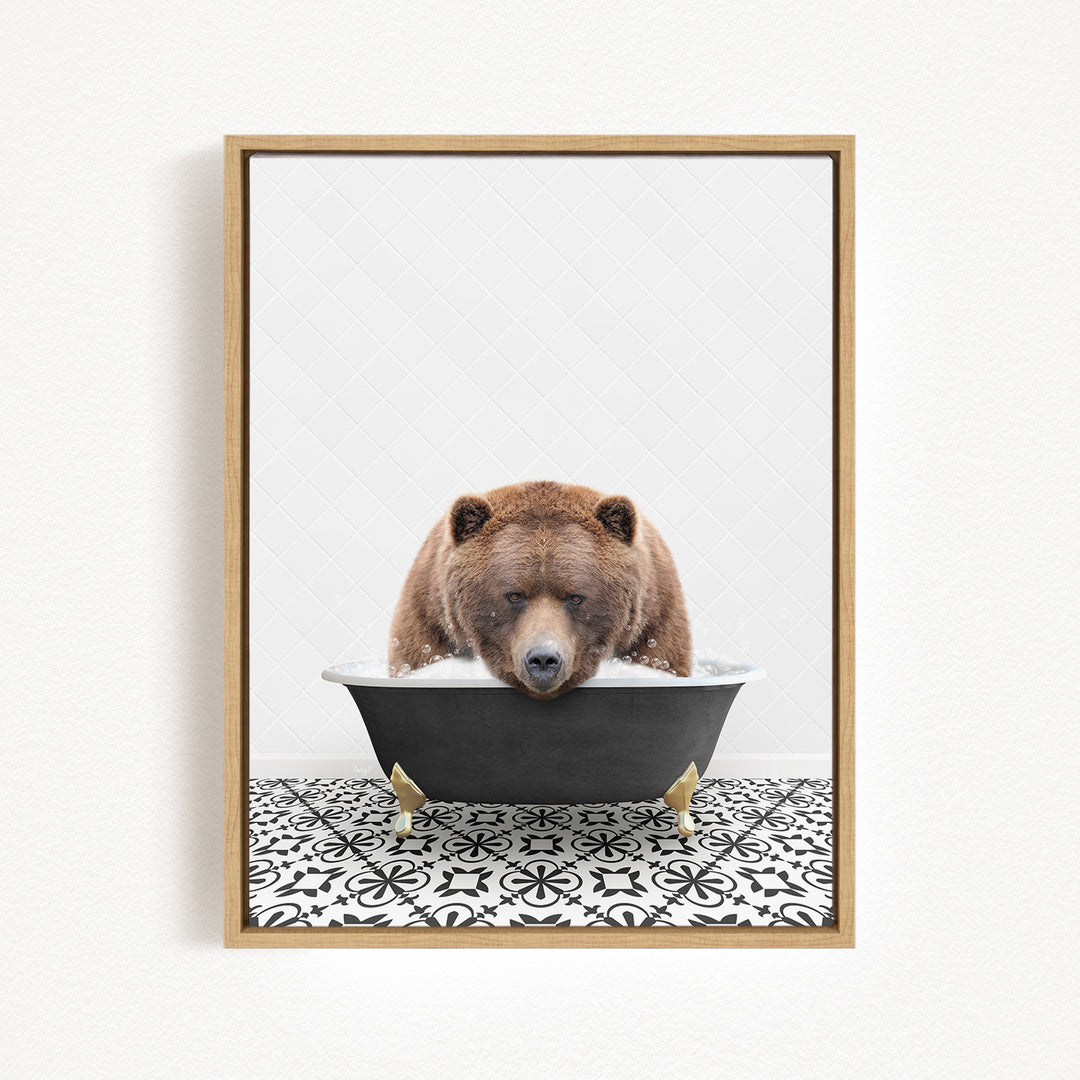 A brown bear is sitting in a bathtub filled with water, appearing to enjoy the experience.