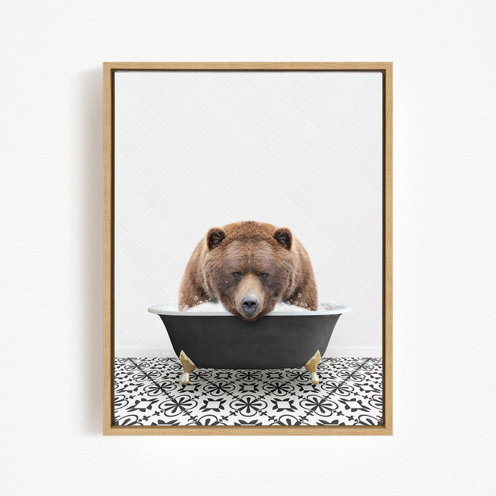 A brown bear is sitting in a bathtub filled with water, appearing to enjoy the experience.