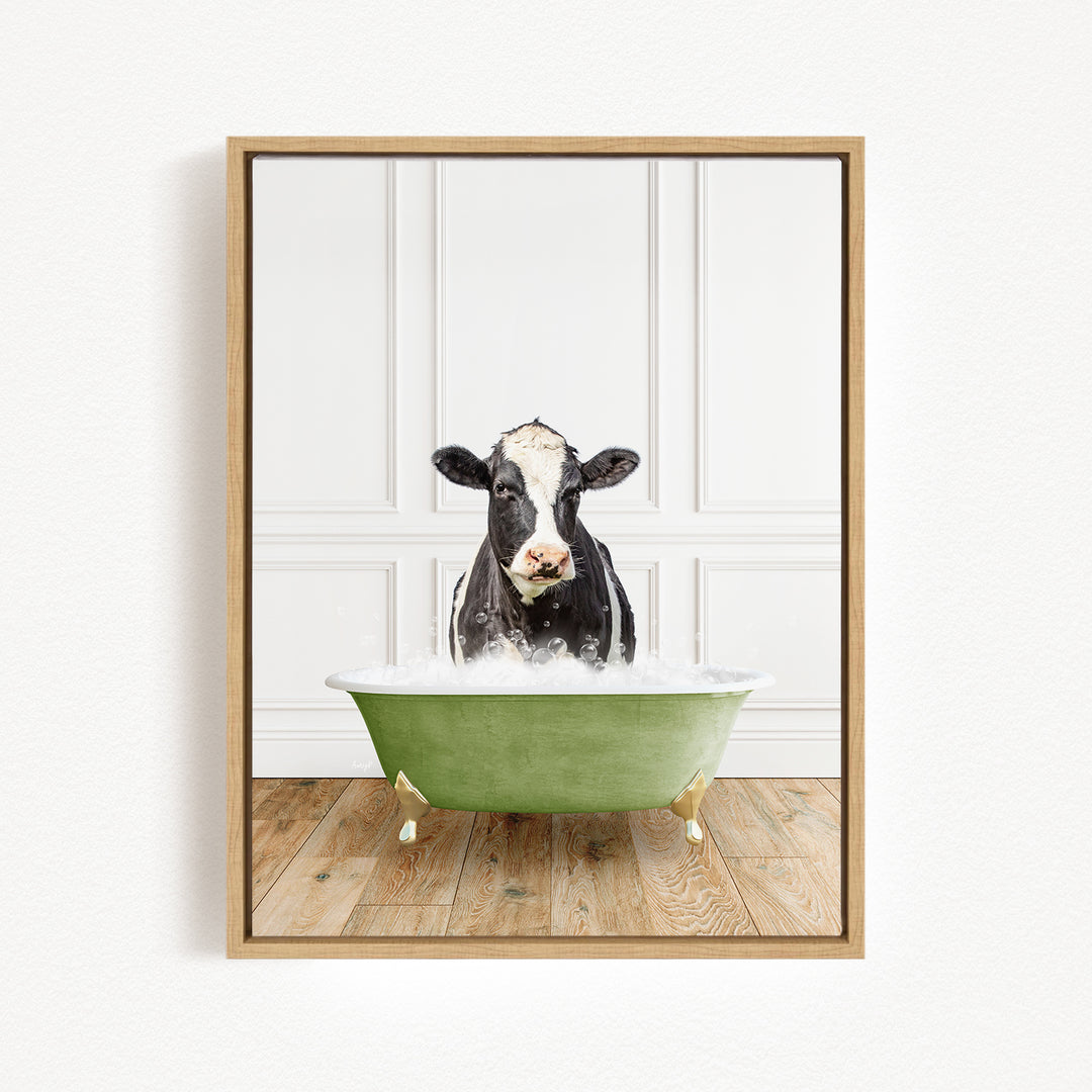 A black and white cow is sitting in a green bathtub filled with water, creating a whimsical and humorous scene.