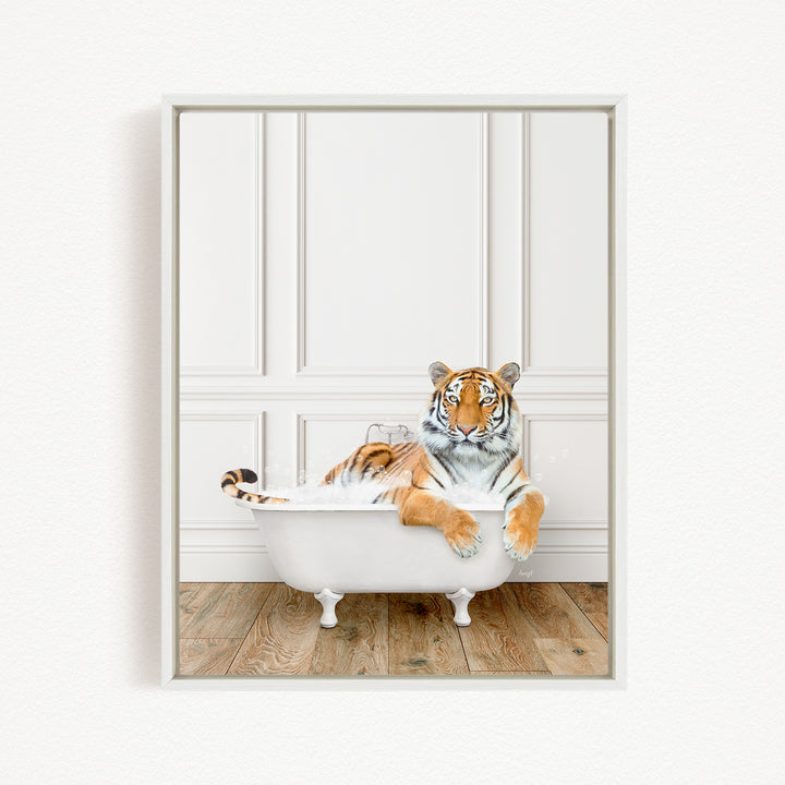 A tiger is sitting in a white bathtub, appearing relaxed and enjoying the bath.