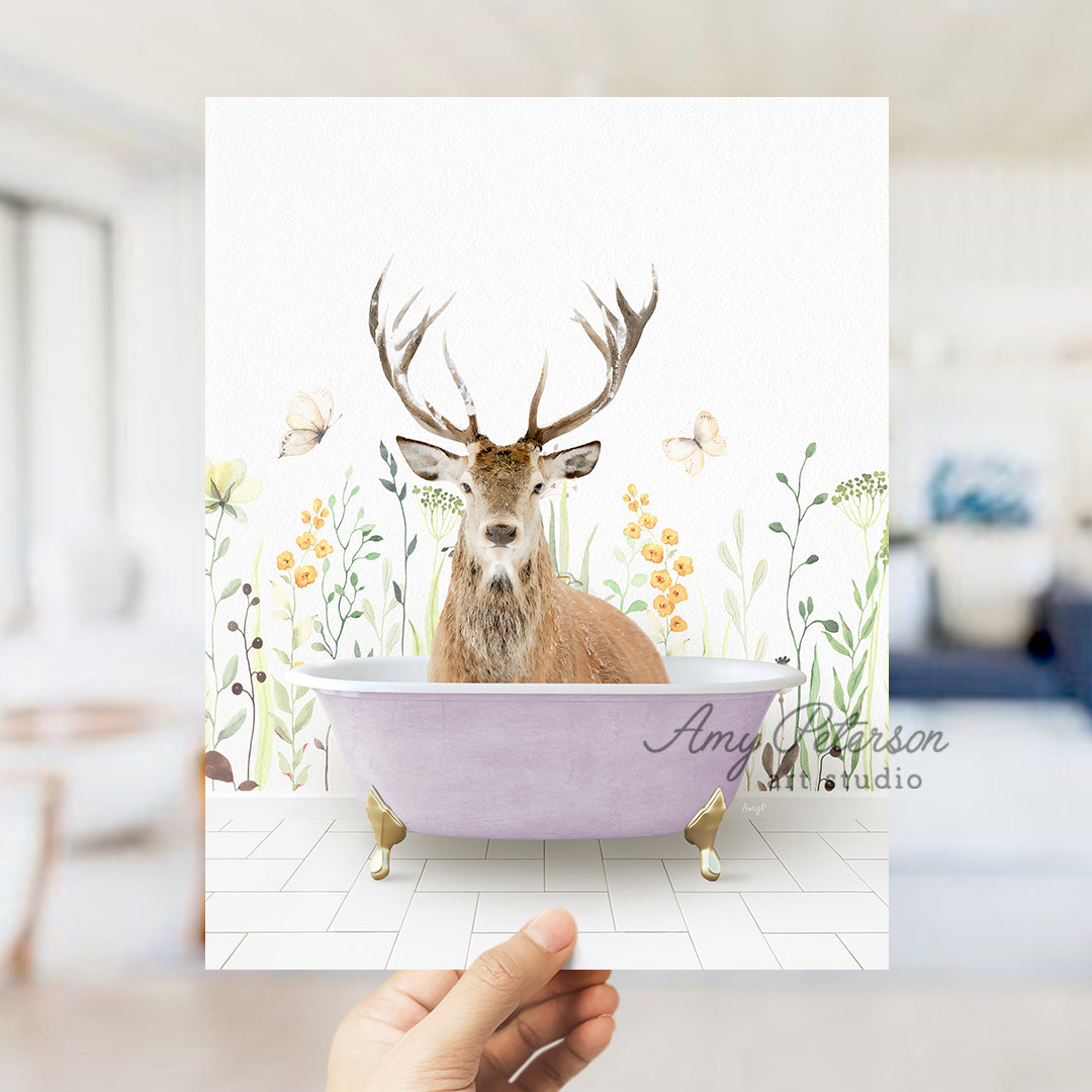 a hand holding up a card with a picture of a deer in a bathtub