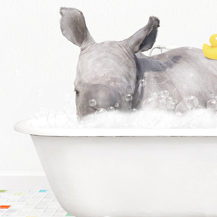 a rhino and a rubber duck in a bathtub