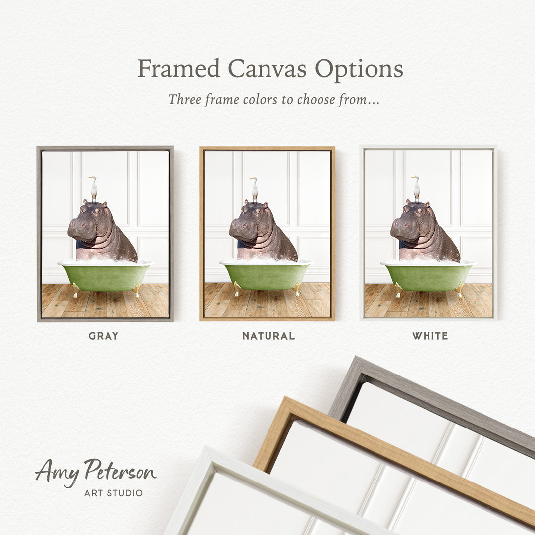 The image is a framed canvas option showcasing three different frame colors: gray, natural, and white. The image features a hippopotamus sitting in a bathtub, with each frame displaying a different color.