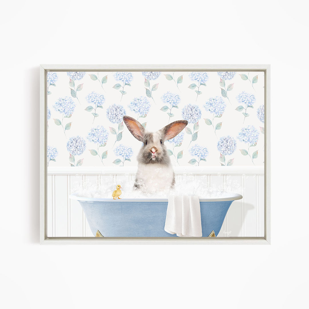 A white rabbit sitting in a blue bathtub, surrounded by a floral patterned wall.