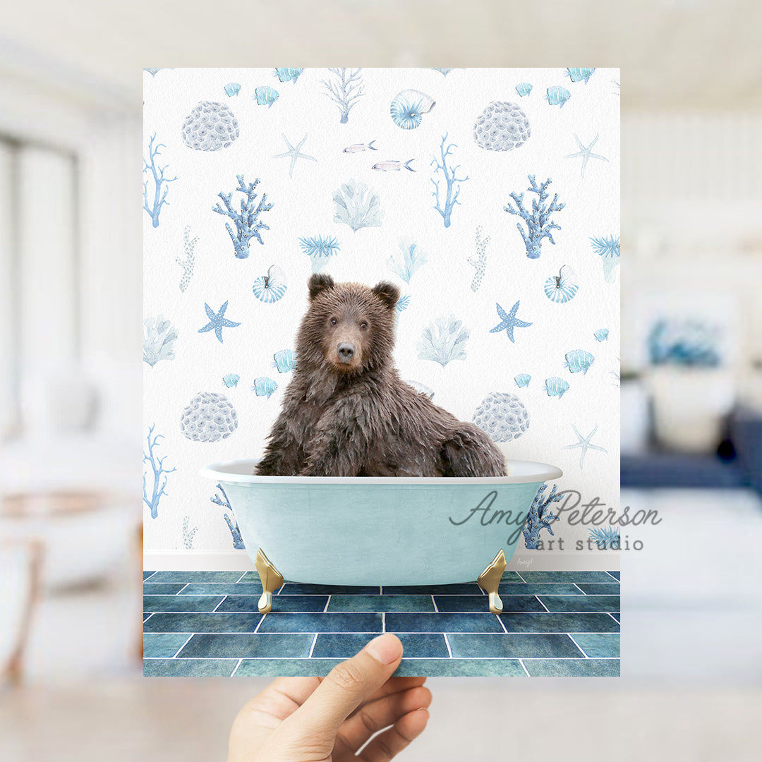 a hand holding up a card with a picture of a bear in a bathtub