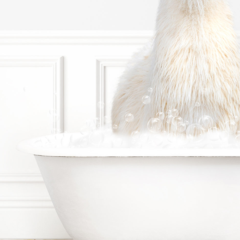 a white bear sitting in a bathtub filled with bubbles