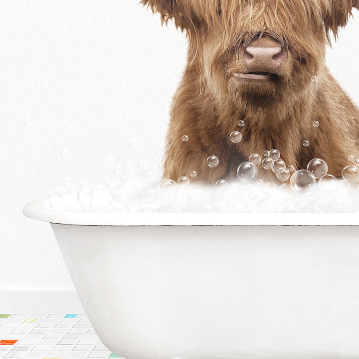 a brown dog sitting in a bathtub filled with bubbles