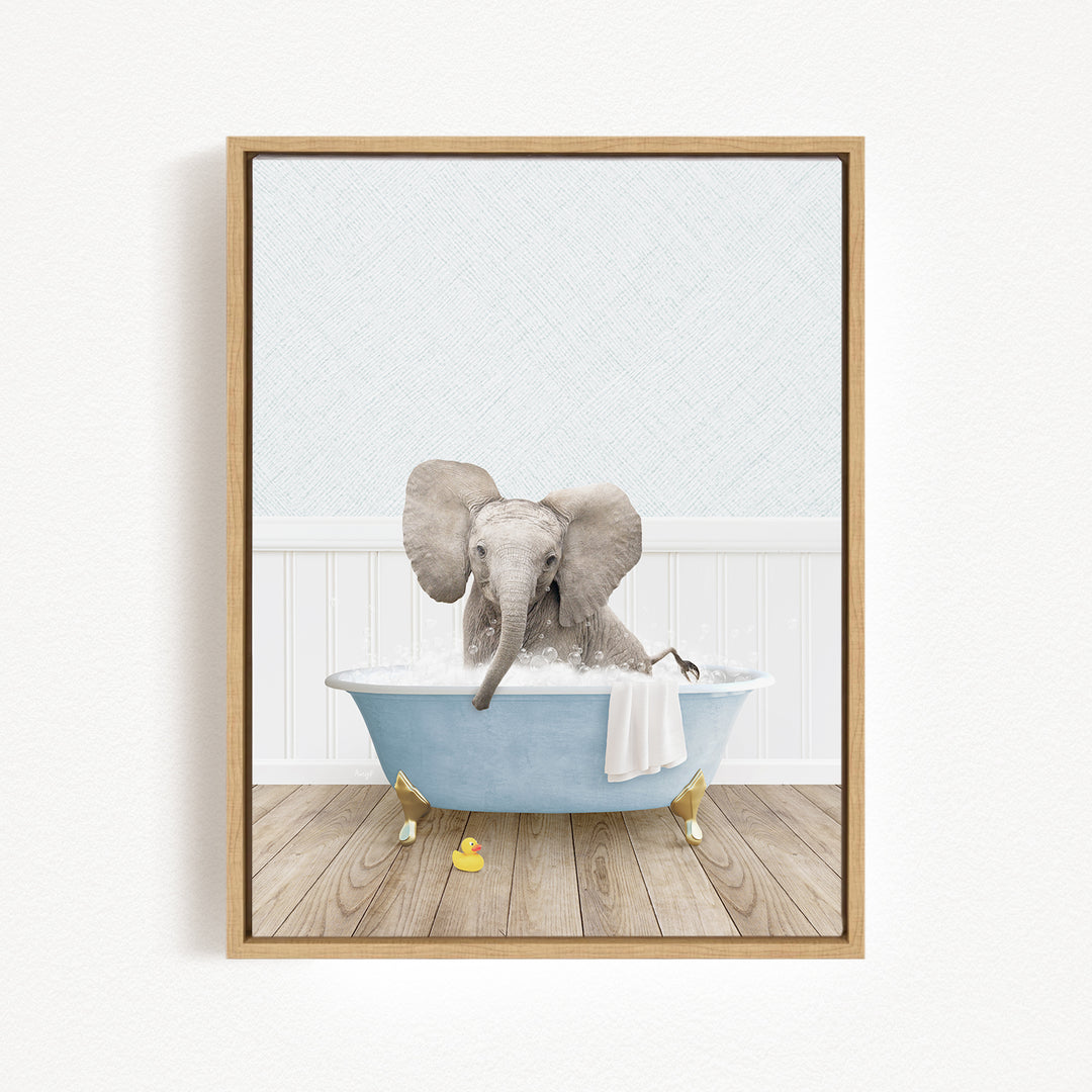 A gray elephant is sitting in a blue bathtub filled with water, surrounded by yellow rubber ducks.
