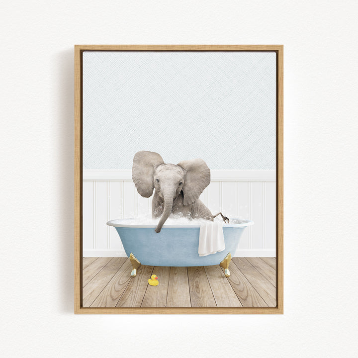 A gray elephant is sitting in a blue bathtub filled with water, surrounded by yellow rubber ducks.
