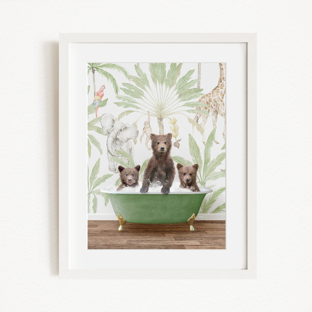 A framed print depicting three bears sitting in a green bathtub, surrounded by a tropical jungle wallpaper.