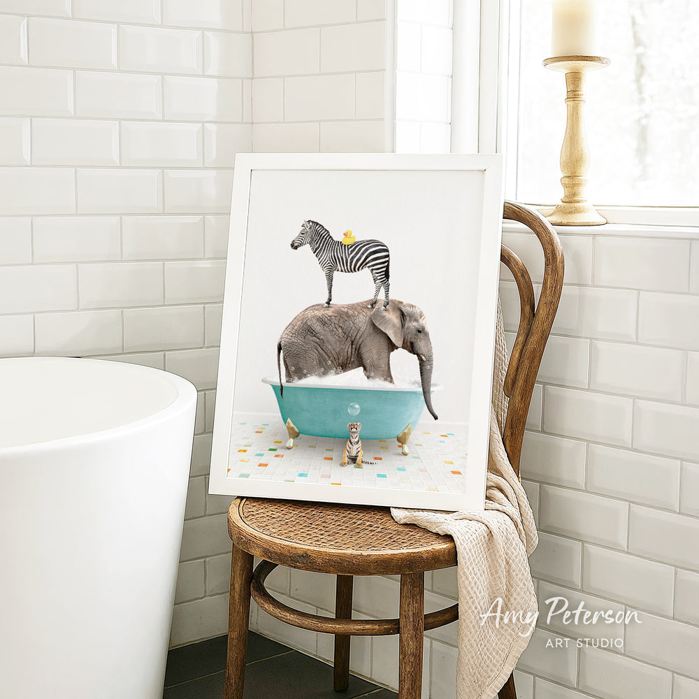 A framed image depicting a zebra standing on an elephant's back while both animals are in a bathtub filled with bubbles.