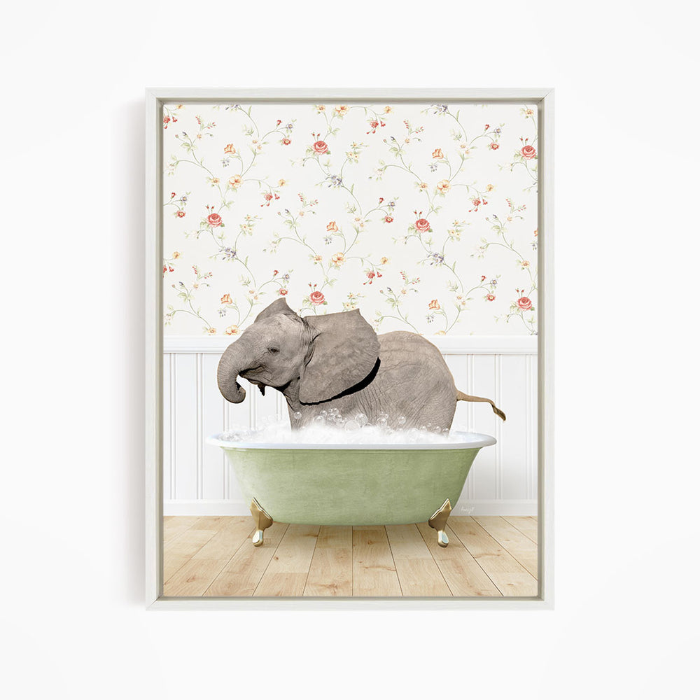 A gray elephant is sitting in a green bathtub filled with water, surrounded by a floral wallpaper.