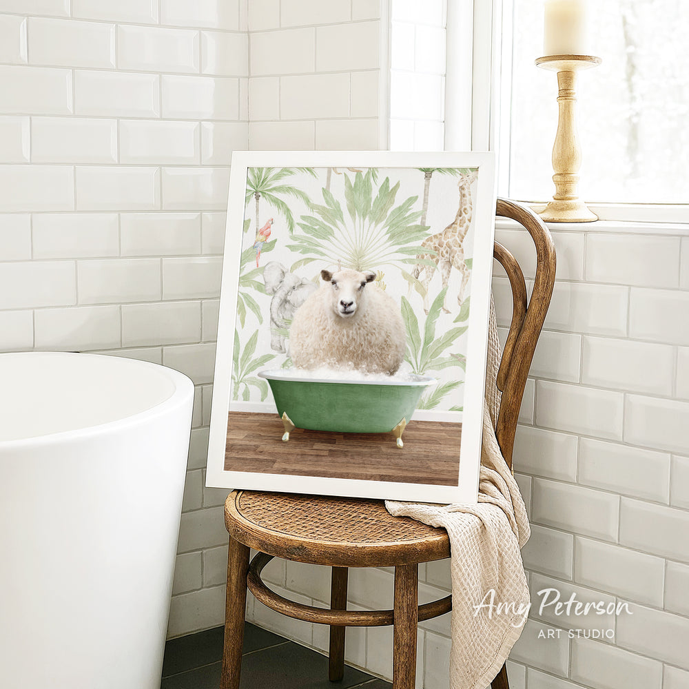A framed print of a sheep sitting in a green bathtub is displayed on a wooden chair in a bathroom setting.