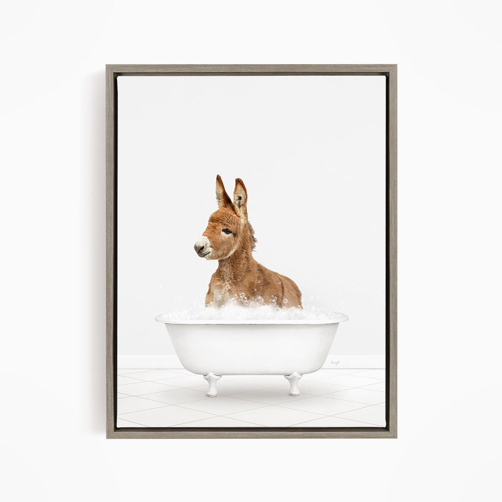 A donkey is sitting in a white bathtub filled with water, creating a playful and whimsical scene.