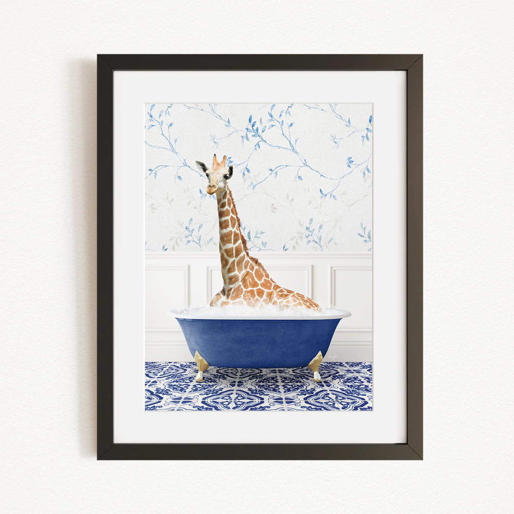 A giraffe sitting in a blue bathtub, surrounded by a patterned tile floor and a white wall with blue floral wallpaper.