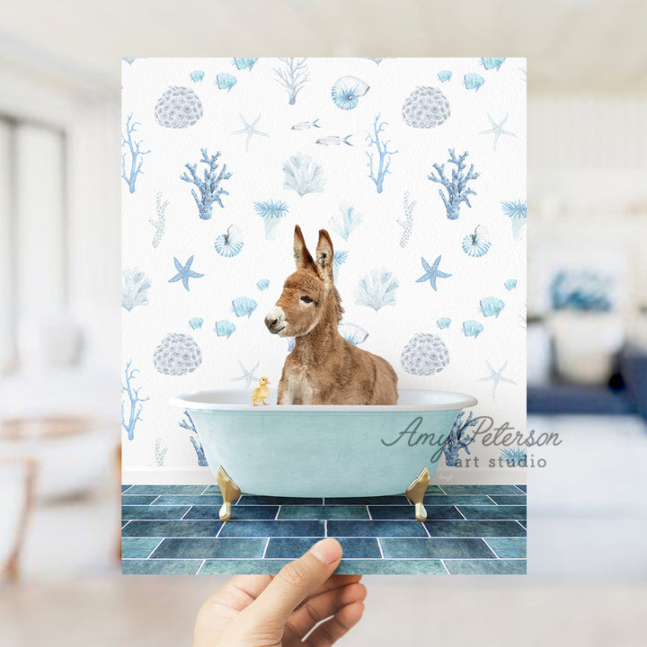 a hand holding a card with a dog in a bathtub