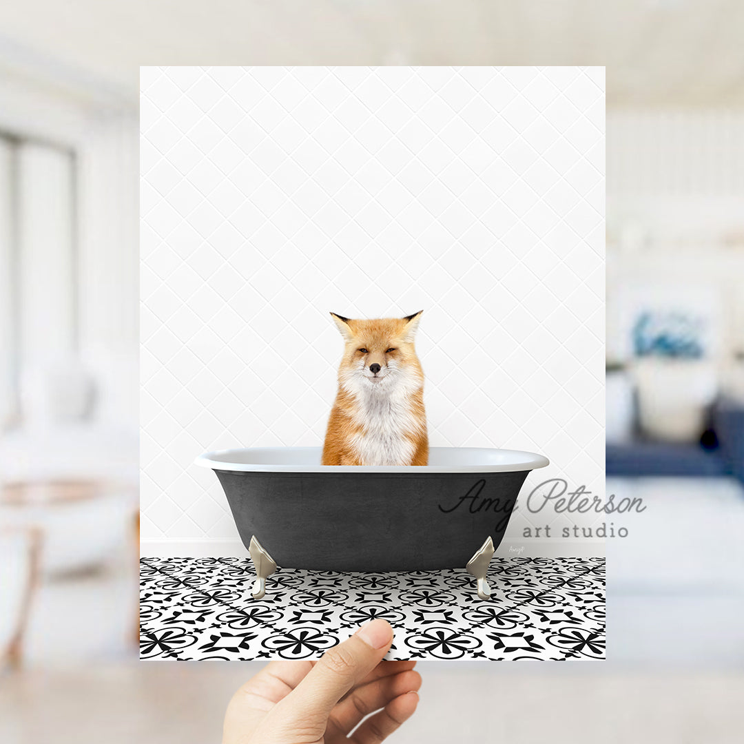 a hand holding up a card with a picture of a fox in a bathtub