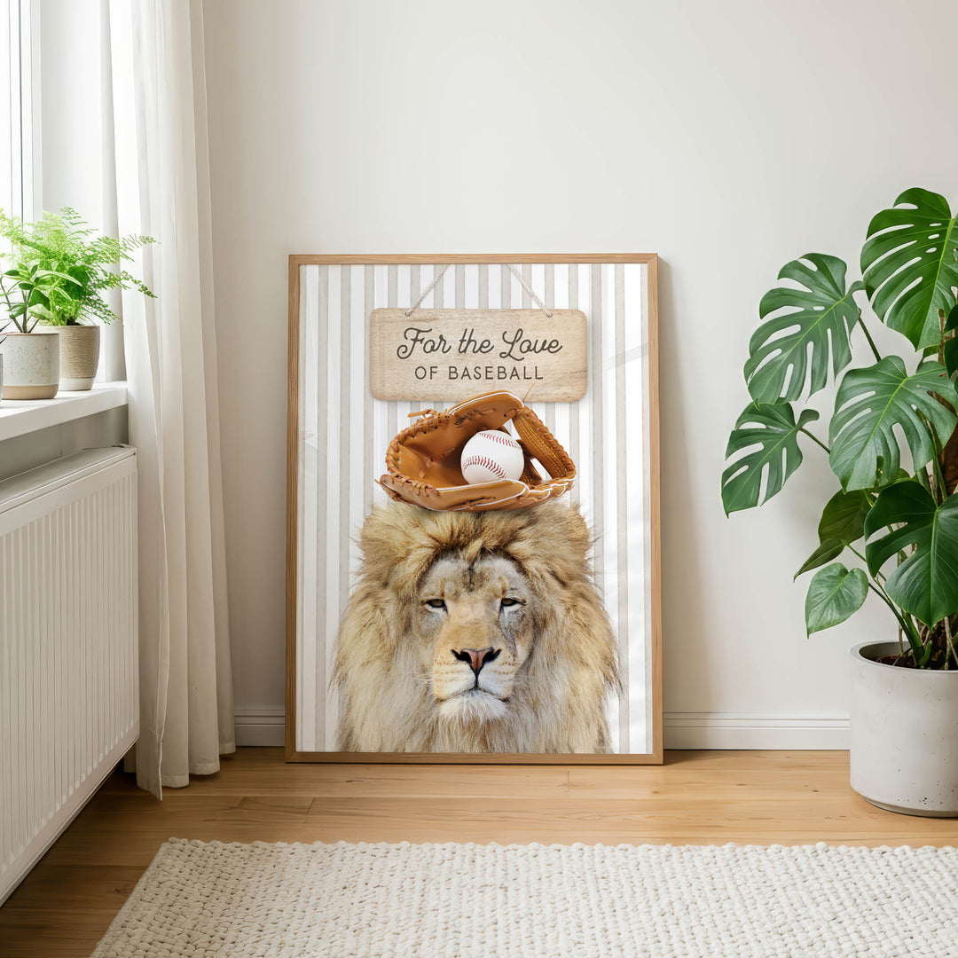 A framed poster featuring a lion wearing a baseball glove and a sign that says "For the Love of Baseball" is displayed on a wall in a room with a rug and potted plants.