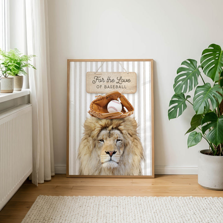 A framed poster featuring a lion wearing a baseball glove and a sign that says "For the Love of Baseball" is displayed on a wall in a room with a rug and potted plants.