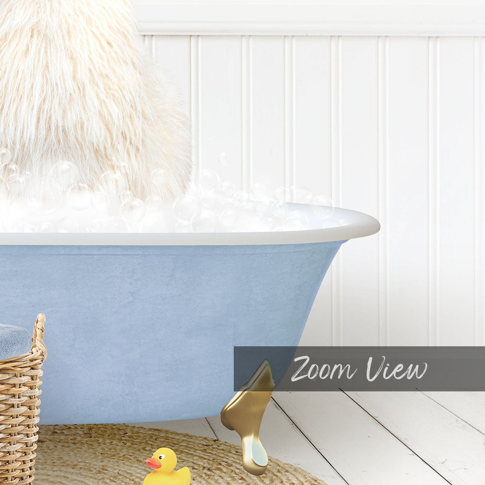 A fluffy white dog is sitting in a blue bathtub filled with bubbles, with a yellow rubber duck nearby.