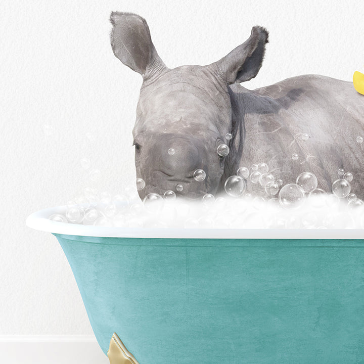 a rhino in a bathtub with bubbles and a rubber duck