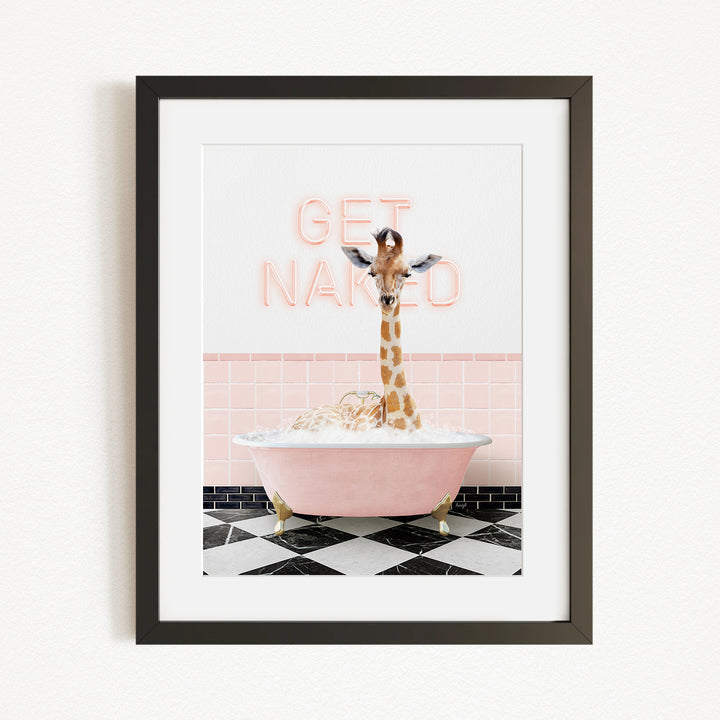 A giraffe standing in a pink bathtub with the words "GET NAKED" written on the wall behind it.