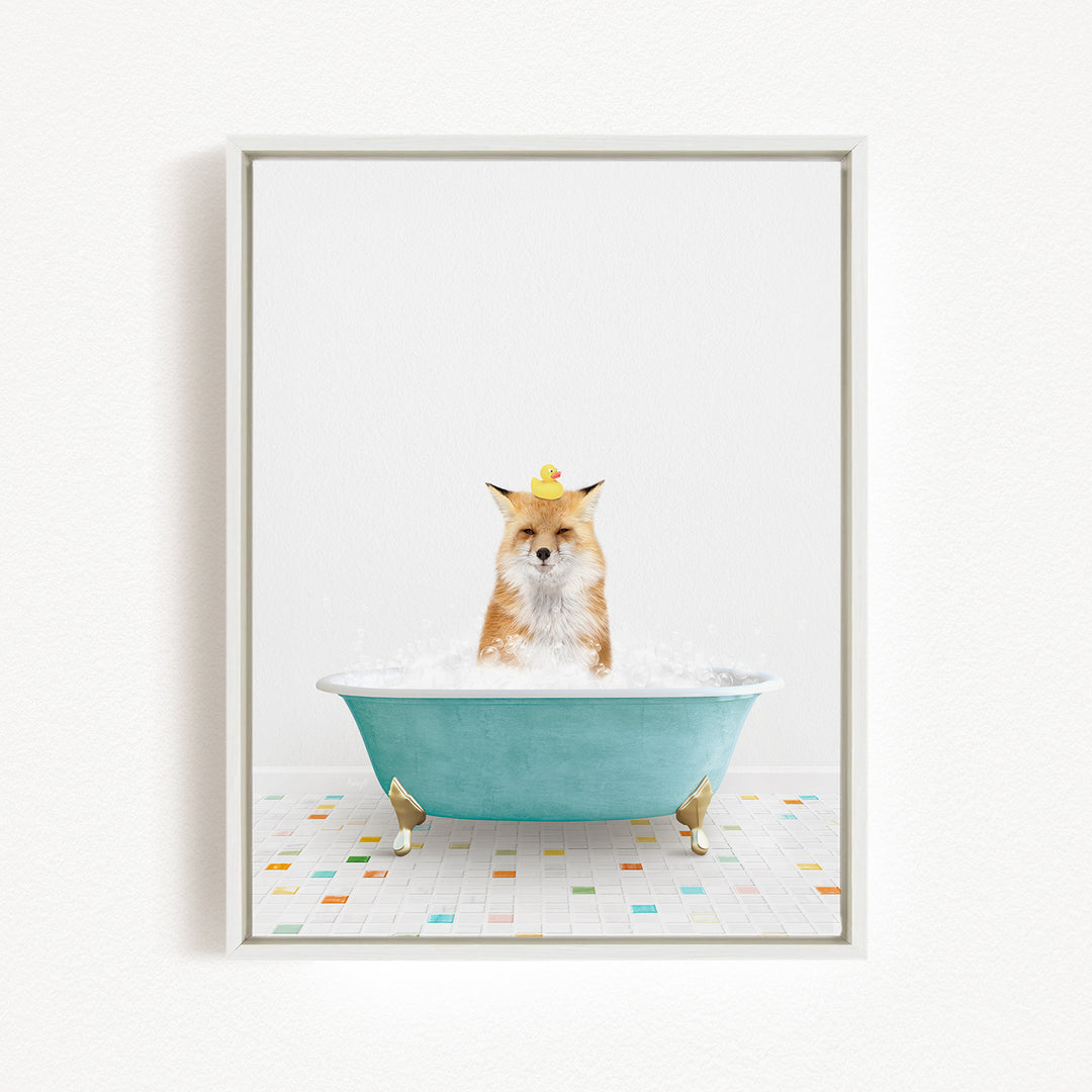 A fox is sitting in a blue bathtub filled with bubbles, with a yellow rubber duck floating on its head.