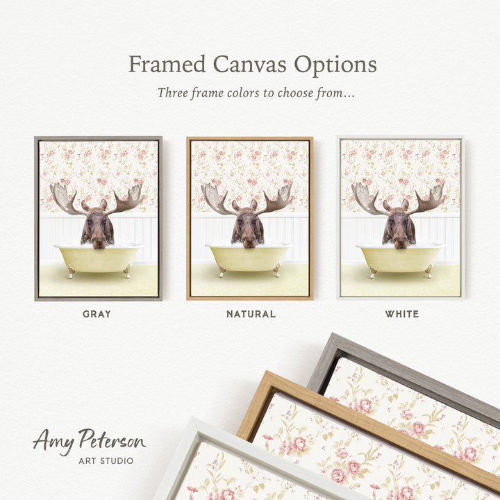 The image is a framed canvas option featuring a moose in a bathtub, with three different frame colors to choose from: gray, natural, and white.