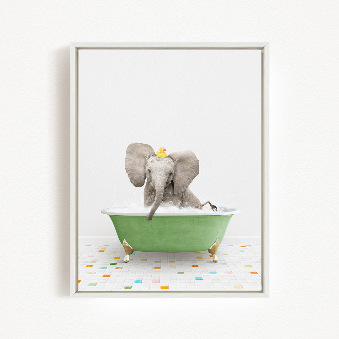 A baby elephant sitting in a green bathtub, with a yellow rubber duck on its head, enjoying a bath.