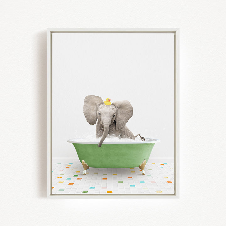 A baby elephant sitting in a green bathtub, with a yellow rubber duck on its head, enjoying a bath.
