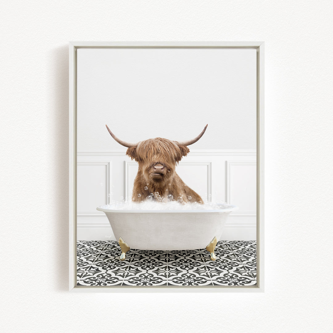 A Highland cow with long horns is sitting in a white bathtub filled with bubbles, creating a whimsical and playful scene.