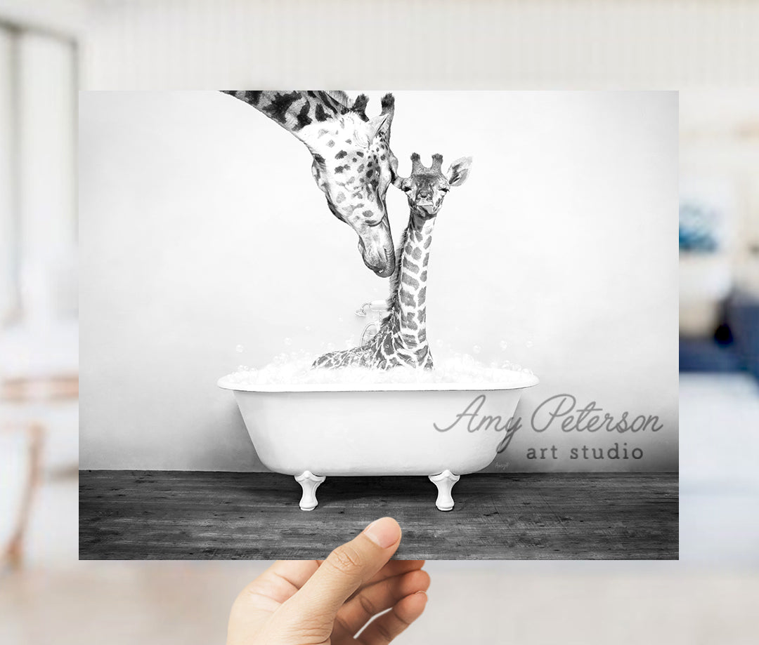 a hand holding up a picture of a giraffe in a bathtub