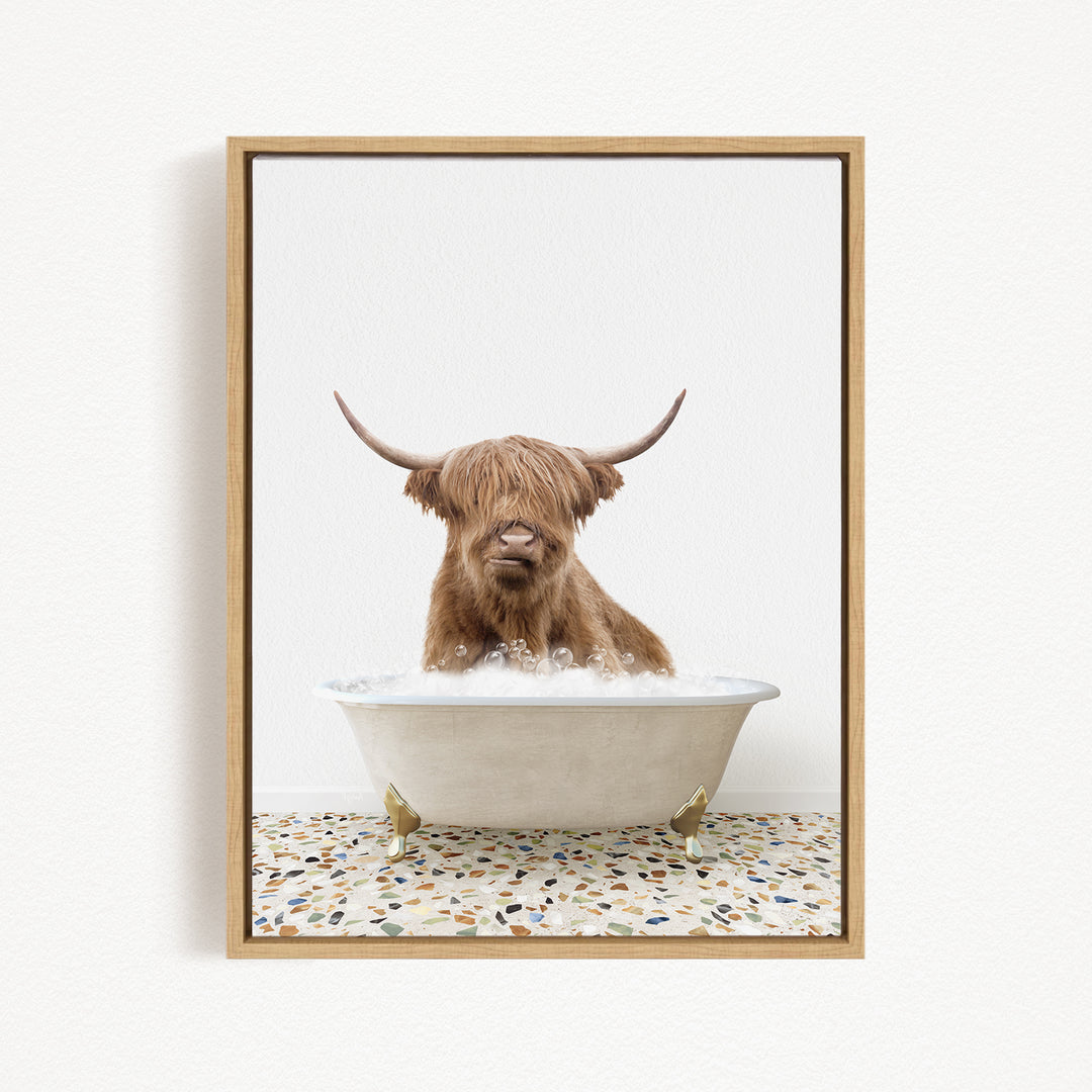 A Highland cow with shaggy brown hair is sitting in a white bathtub filled with water, creating a whimsical and playful scene.
