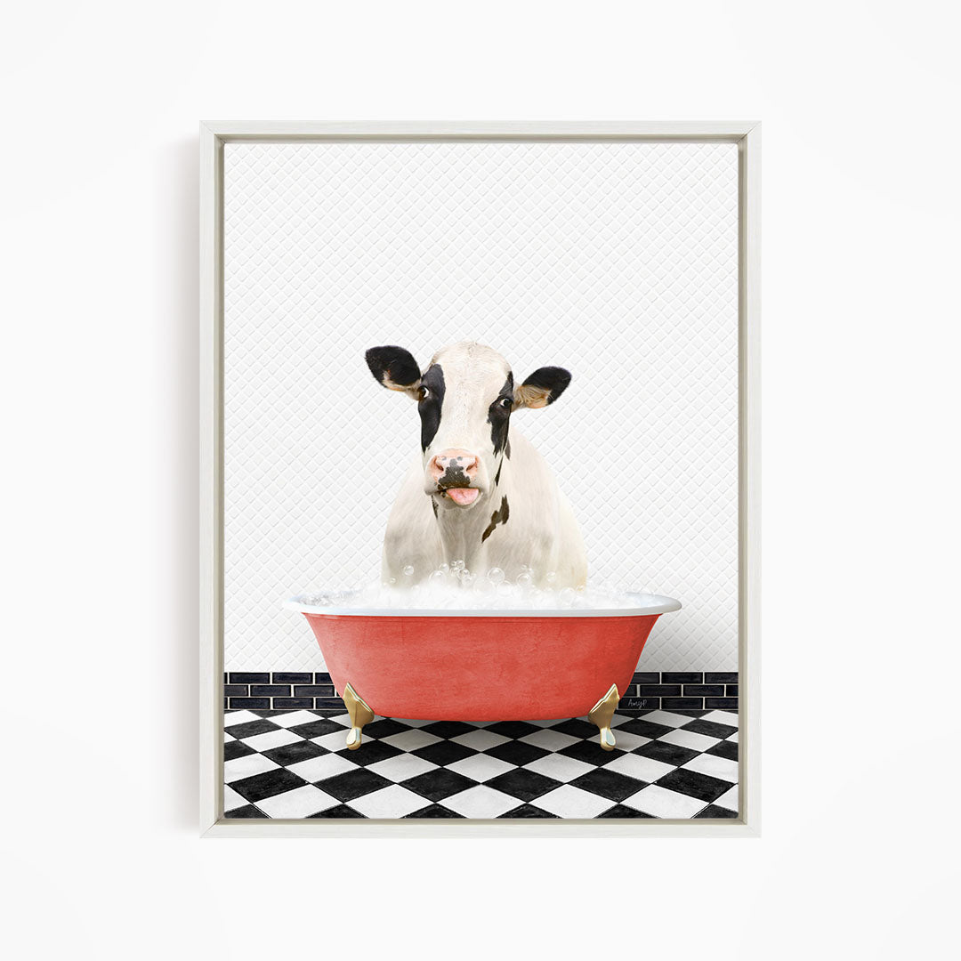 A black and white cow is sitting in a red bathtub filled with water, creating a whimsical and humorous scene.