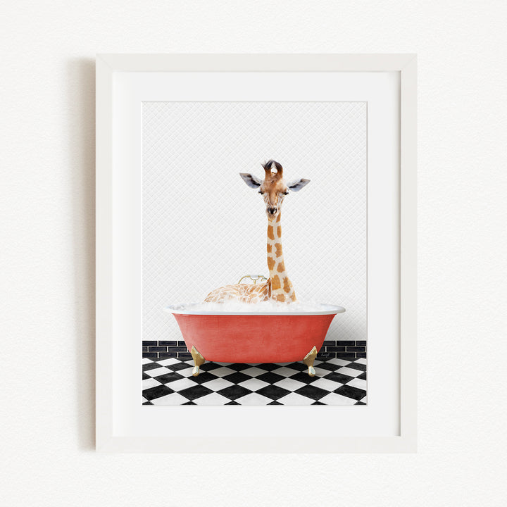 A giraffe is sitting in a red bathtub filled with bubbles, surrounded by a black and white checkered floor.
