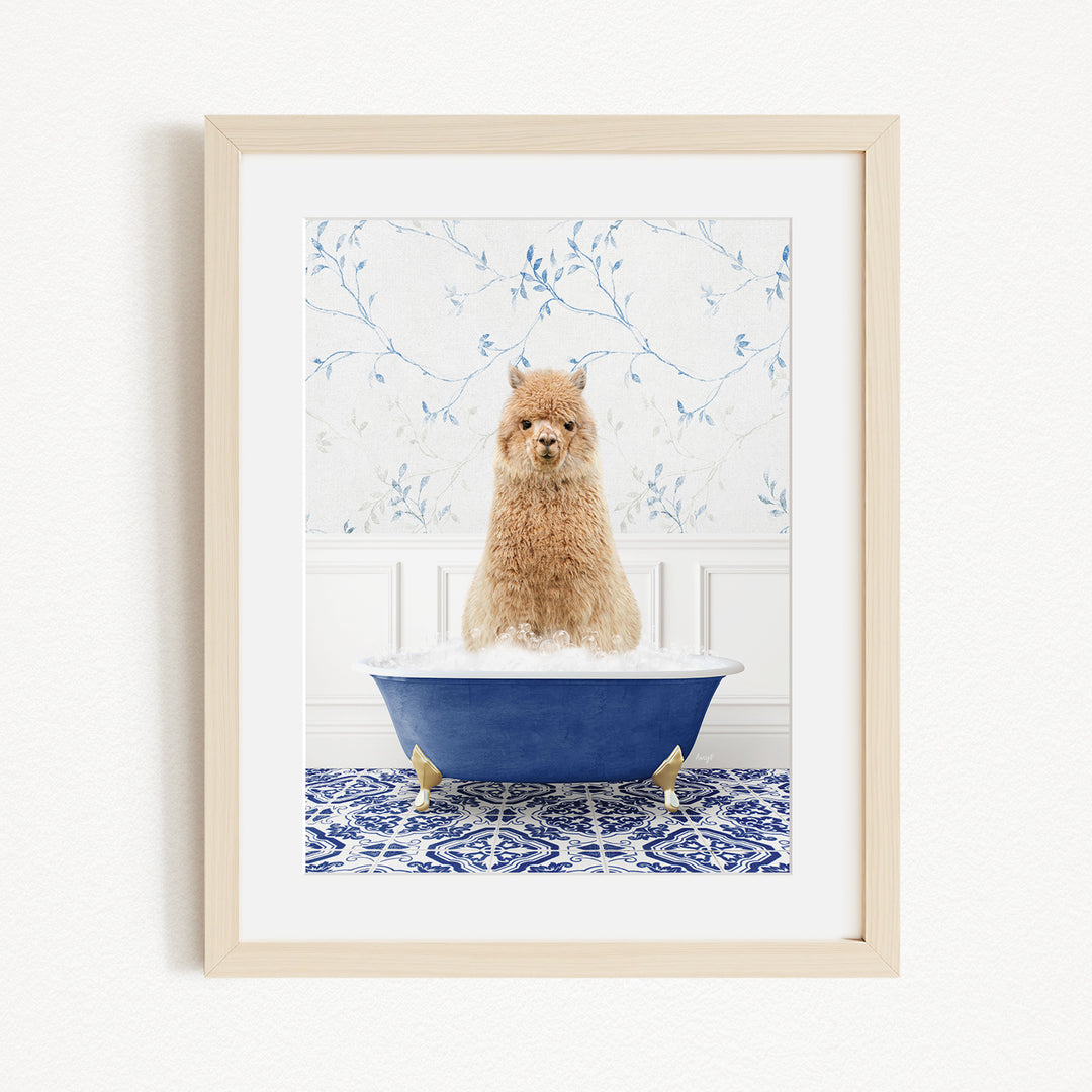 A fluffy brown dog sitting in a blue bathtub filled with bubbles, with a blue and white floral patterned wall behind it.