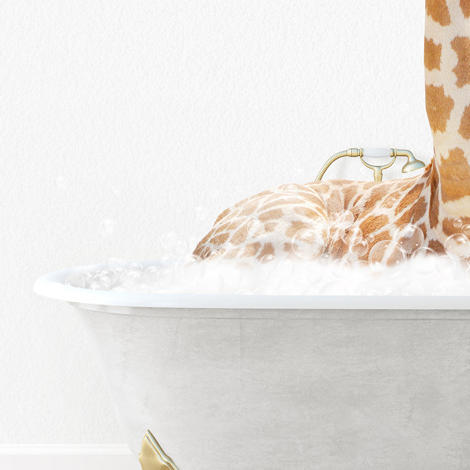 a giraffe laying in a bathtub with foam on it