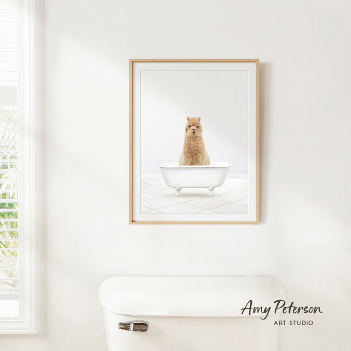 A framed image of a small brown dog sitting in a white bathtub, with a window and a white toilet visible in the background.
