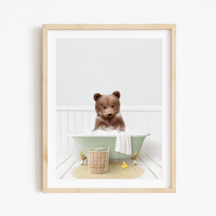 A brown bear sitting in a green bathtub filled with bubbles, surrounded by rubber duckies and a basket.
