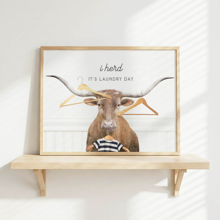 a bull with large horns and a person holding a shirt, with the text "It's laundry day" displayed above the bull.