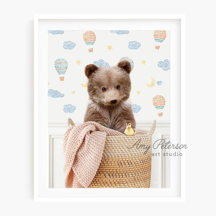 a brown teddy bear sitting in a basket