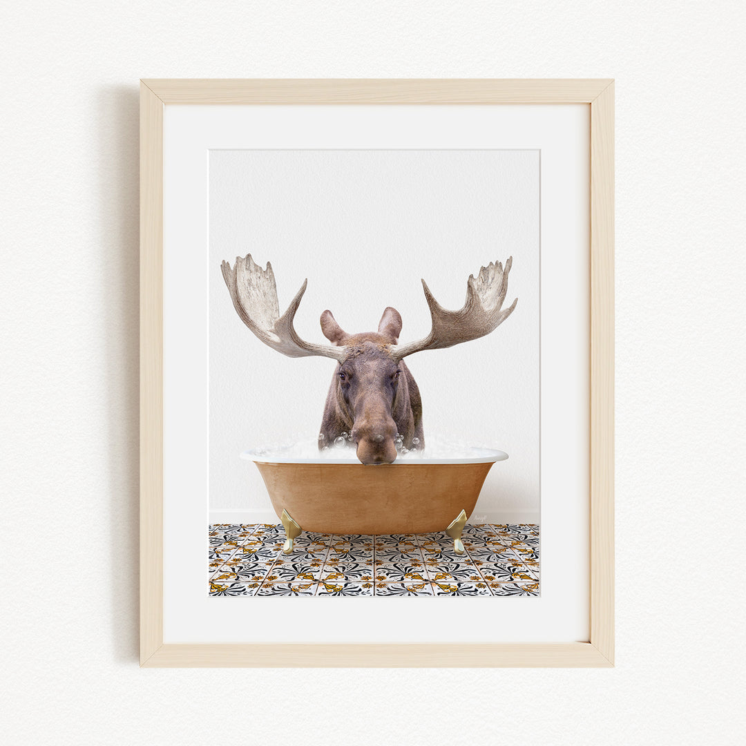 A moose with large antlers is sitting in a bathtub, with a patterned tile floor in the background.