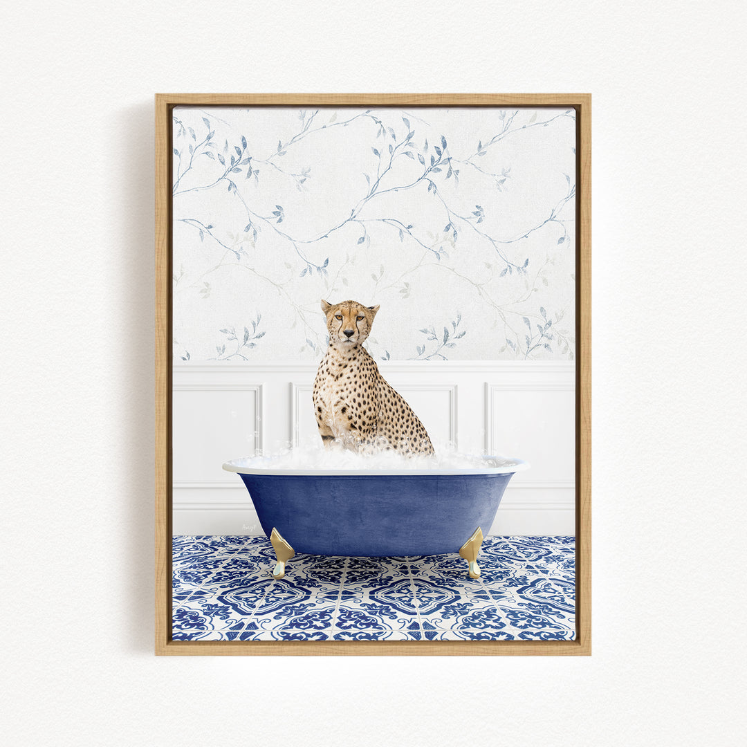 A cheetah sitting in a blue bathtub filled with water, surrounded by a blue and white patterned rug.