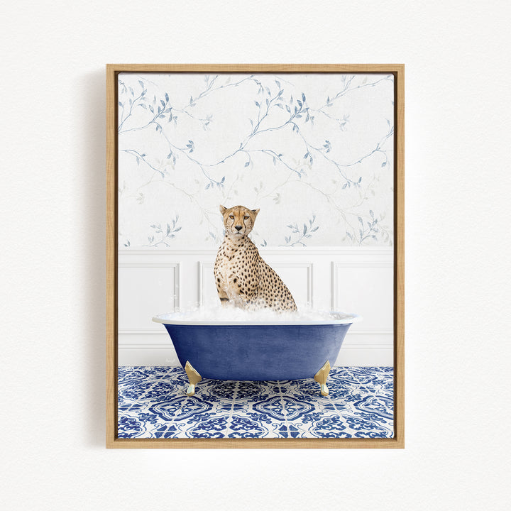 A cheetah sitting in a blue bathtub filled with water, surrounded by a blue and white patterned rug.