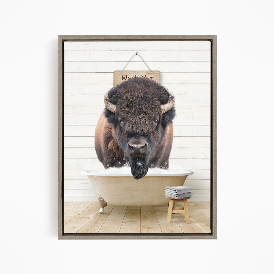 A buffalo is sitting in a bathtub, with a sign above it that says "Waxing yer".