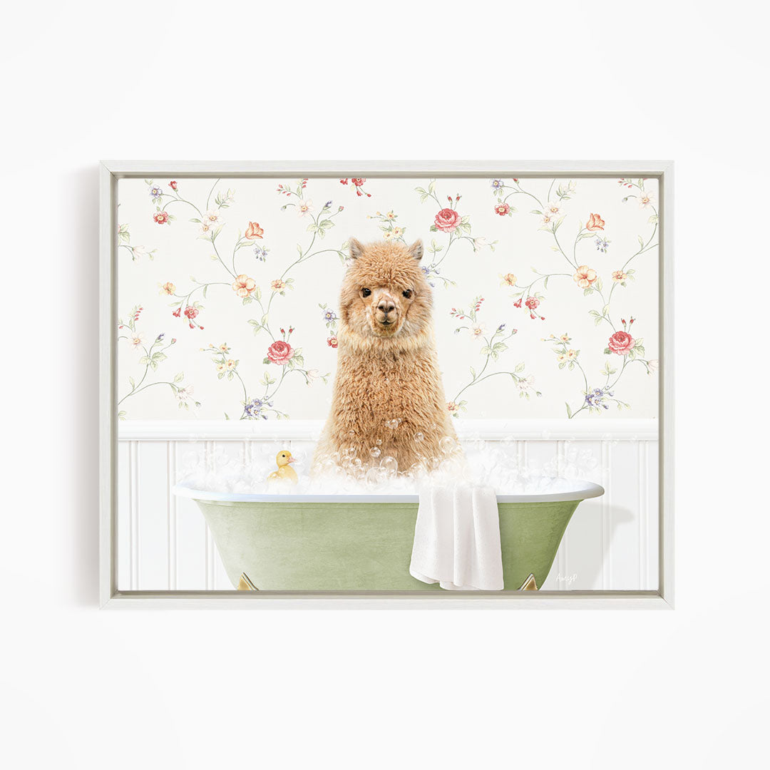 A fluffy brown alpaca sitting in a green bathtub filled with bubbles, surrounded by a floral wallpaper.