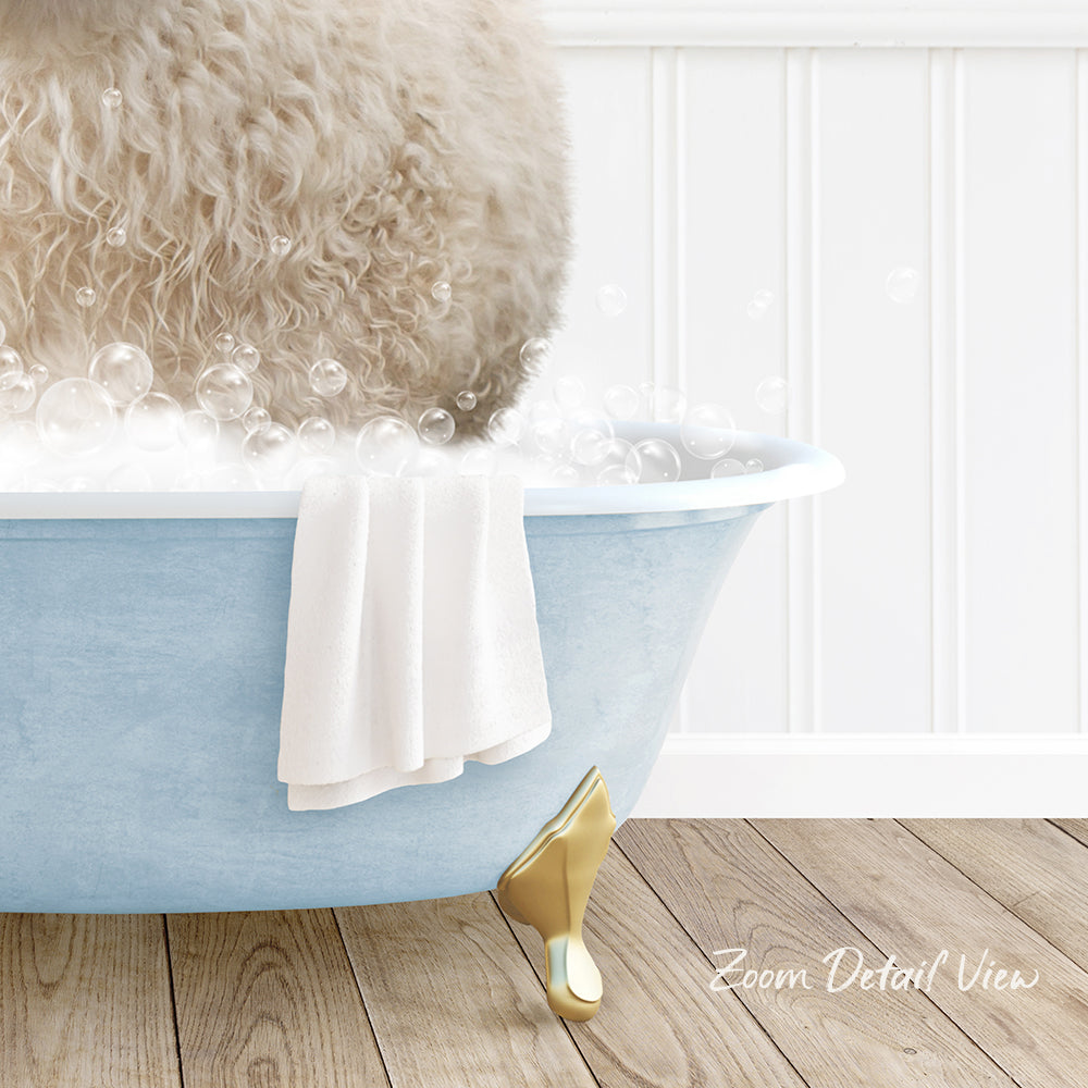 A fluffy white dog is sitting in a blue bathtub filled with bubbles, with a white towel and gold bathtub leg visible.