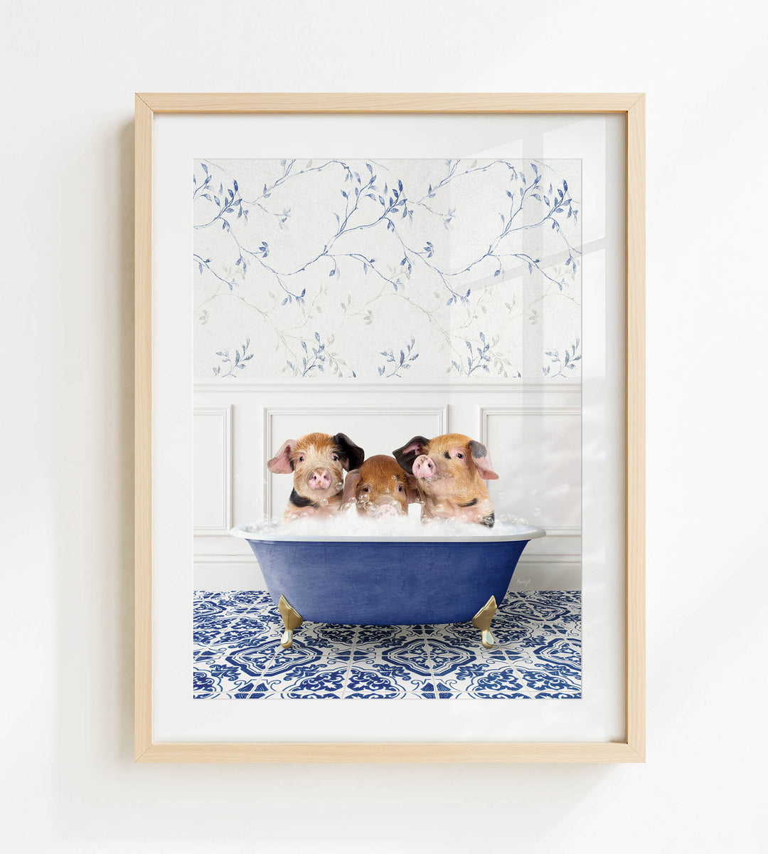Three adorable pigs sitting in a blue bathtub, surrounded by a patterned tile floor and a white wall with a blue floral wallpaper.